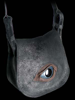 In the protection of the all-seeing eye of the gods! An eerily realistic enamelled metal and hand crafted leather eye, unflinchingly peers from the front flap of this stylish shoulder bag. Hand made of vintage-style black leather with adjustable strap; Approx. dimensions: 19.5cm (7") wide X 17.5cm (6") high X 7cm (2") deep. 